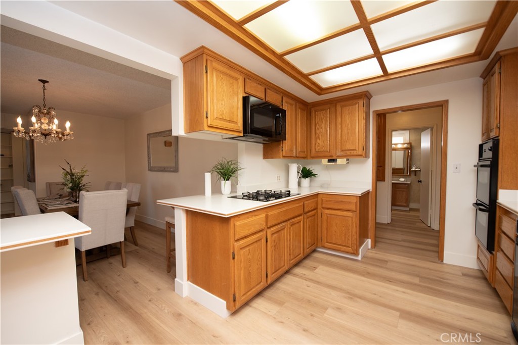 1112 Steele Drive Brea, CA 92821 - Photo 10 of 34 a kitchen with stainless steel appliances granite countertop a sink stove and refrigerator