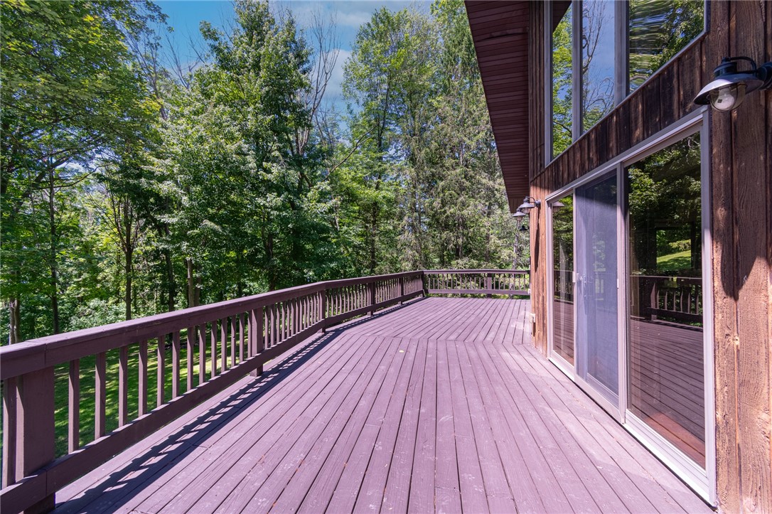7733 East Port Bay Road Wolcott, NY 14590 - Photo 7 of 49 The HUGE wrap around deck!