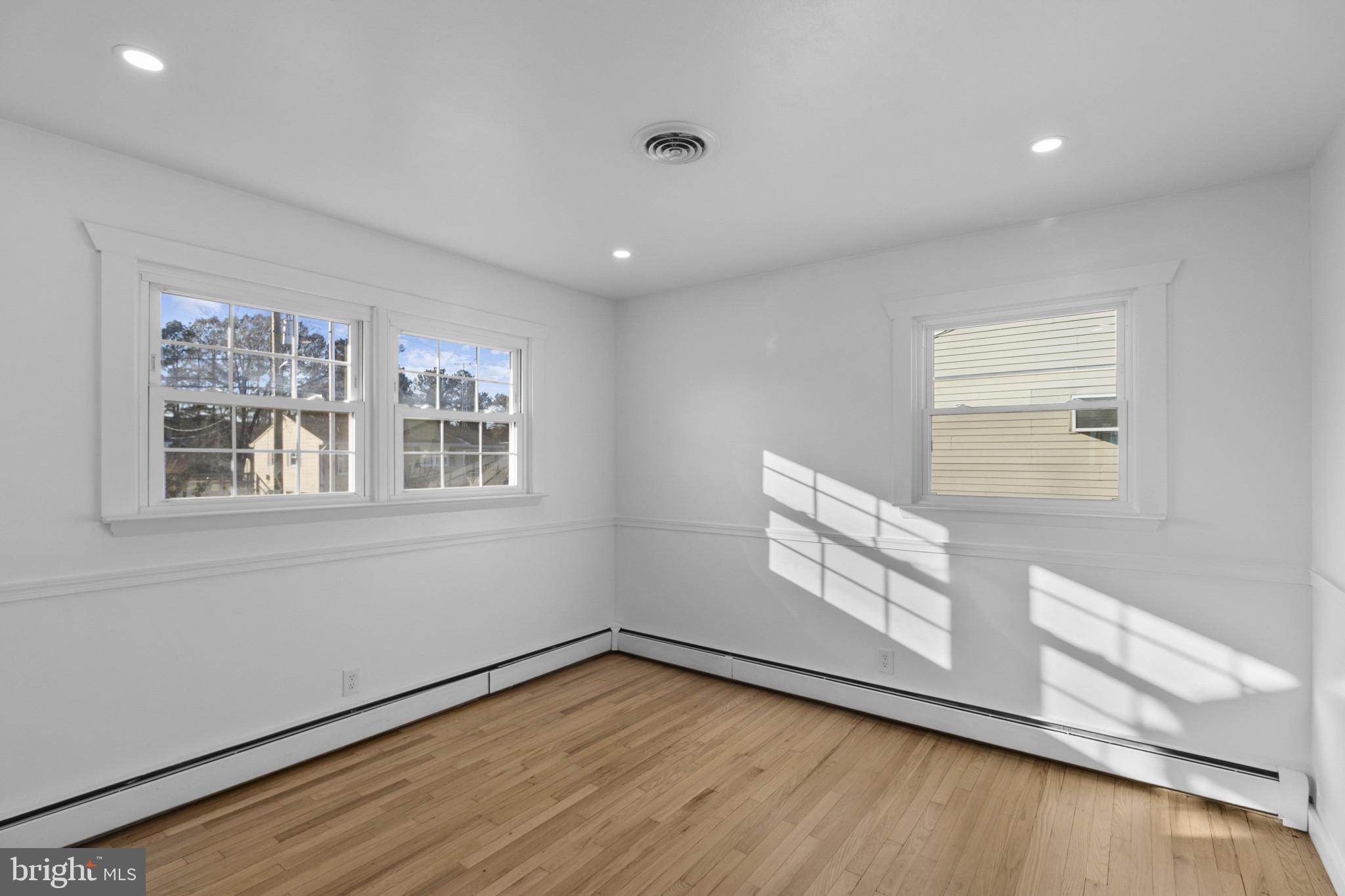 809 South Scott Street Middletown, DE 19709 - Photo 12 of 25 a view of an empty room with wooden floor and a window