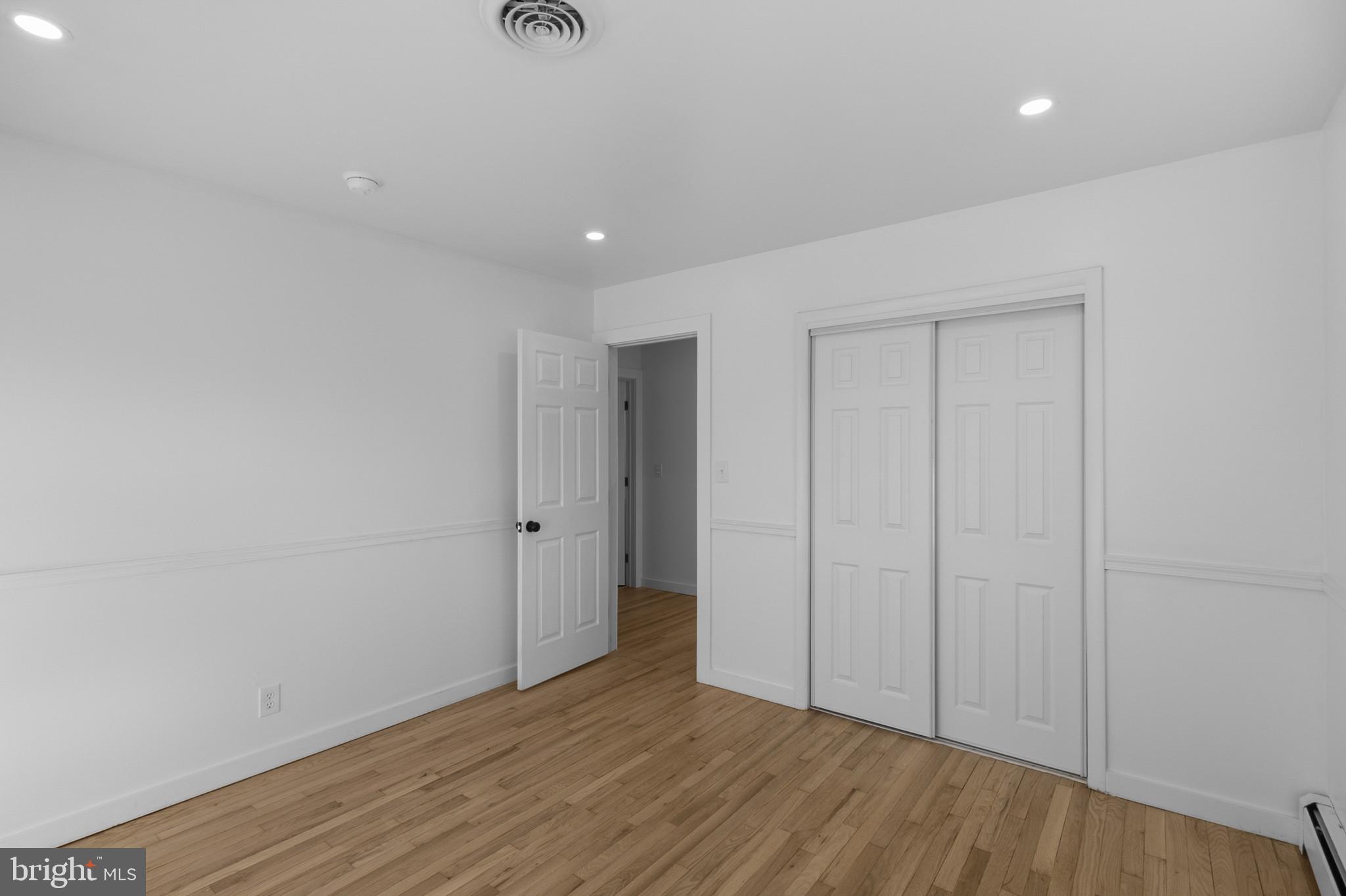 809 South Scott Street Middletown, DE 19709 - Photo 14 of 25 a view of an empty room with wooden floor