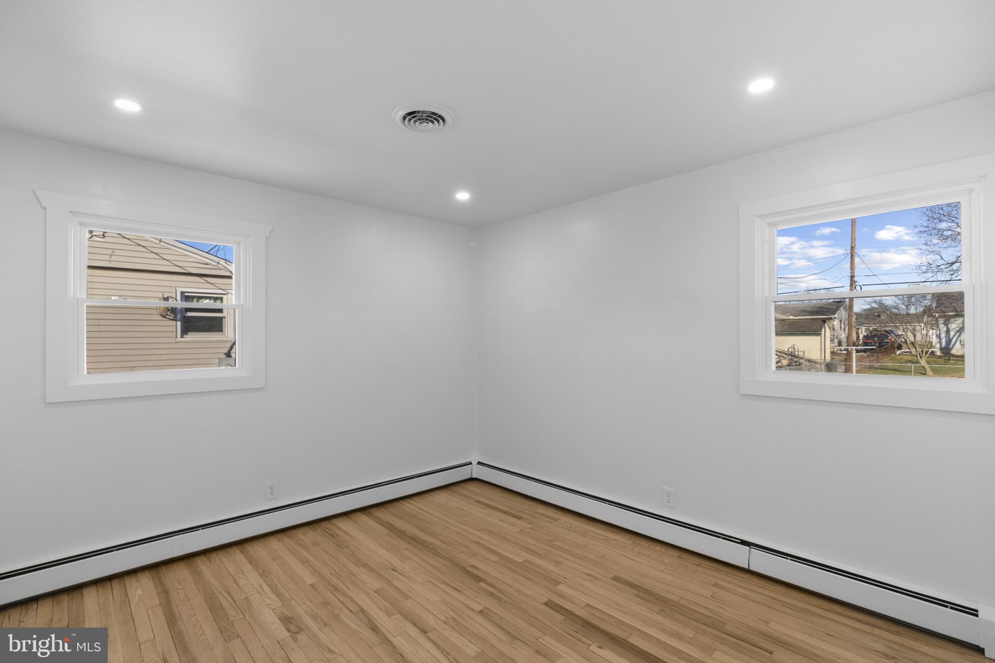 809 South Scott Street Middletown, DE 19709 - Photo 15 of 25 a view of an empty room with a window and wooden floor