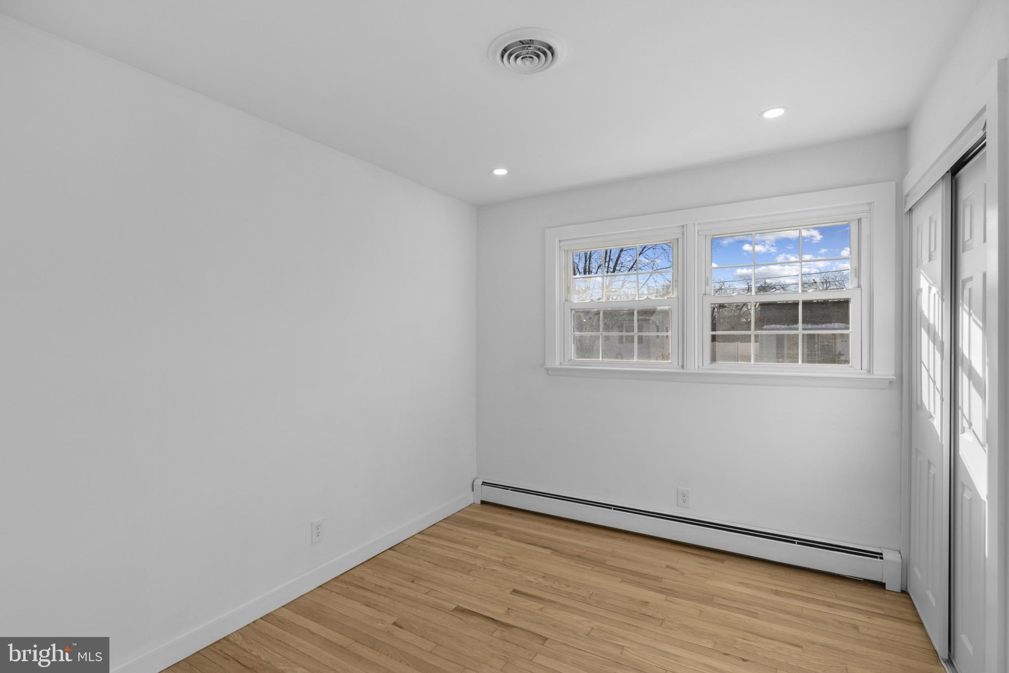 809 South Scott Street Middletown, DE 19709 - Photo 9 of 25 a view of an empty room with wooden floor and a window