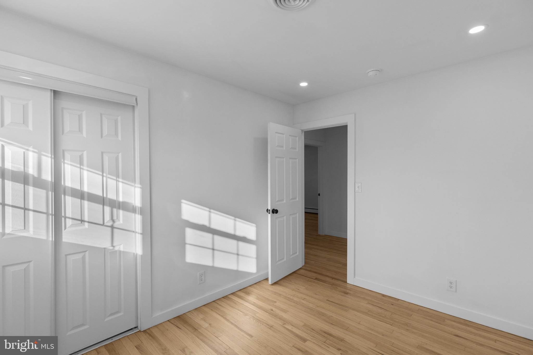 809 South Scott Street Middletown, DE 19709 - Photo 10 of 25 a view of an empty room with wooden floor and a window