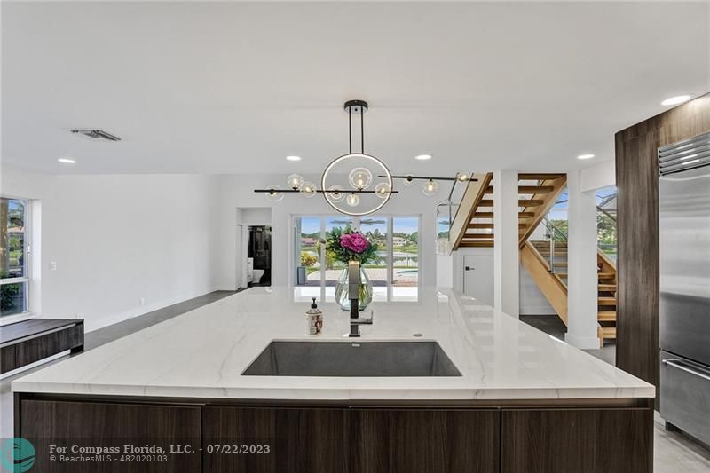 12355 Rockledge Circle Boca Raton, FL 33428 - Photo 11 of 38 a table with wine bottles and sink in it