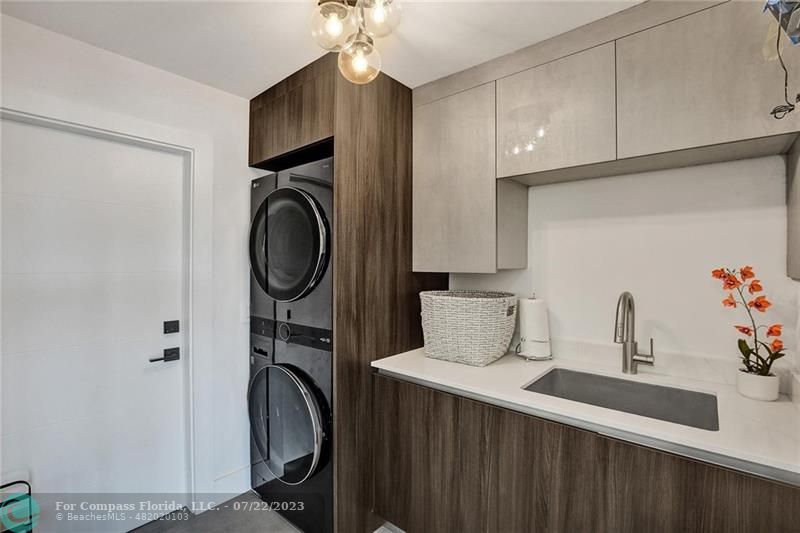 12355 Rockledge Circle Boca Raton, FL 33428 - Photo 13 of 38 a utility room with sink dryer and washer