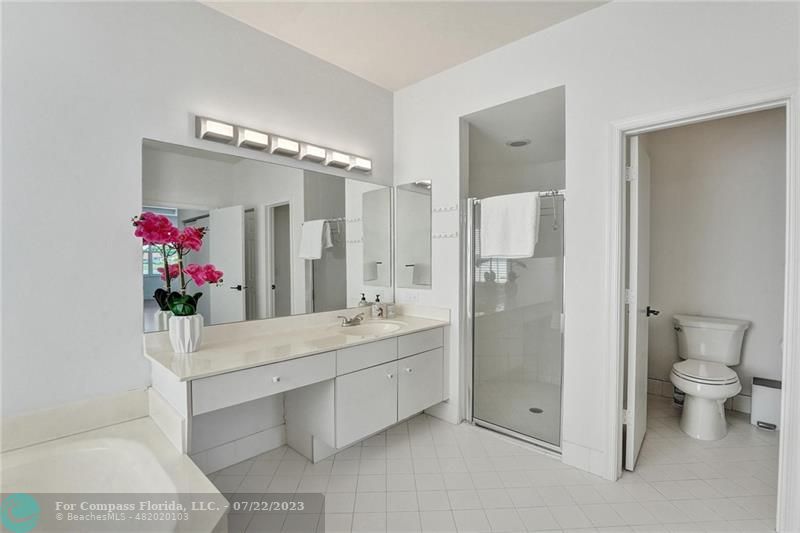 12355 Rockledge Circle Boca Raton, FL 33428 - Photo 20 of 38 a bathroom with a double vanity sink mirror and toilet