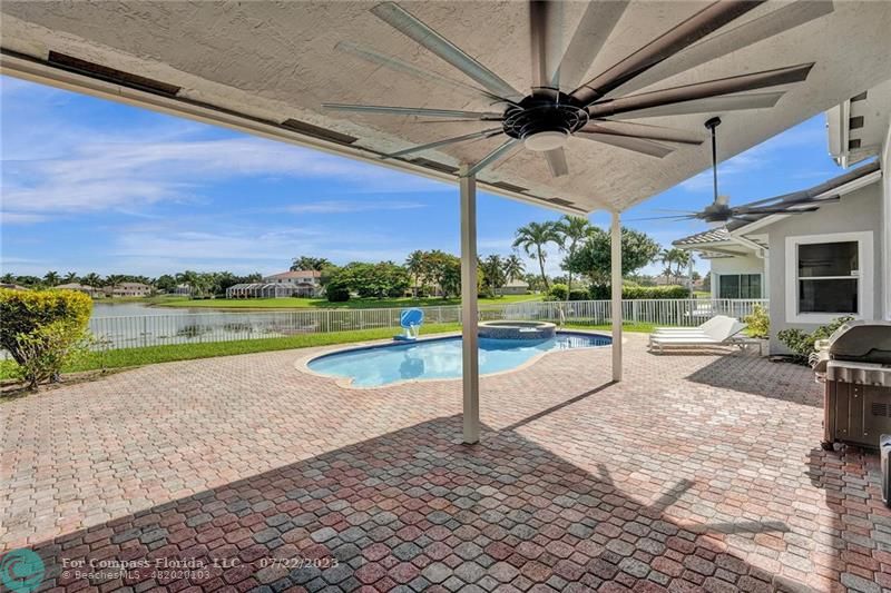 12355 Rockledge Circle Boca Raton, FL 33428 - Photo 28 of 38 a view of a swimming pool with a patio