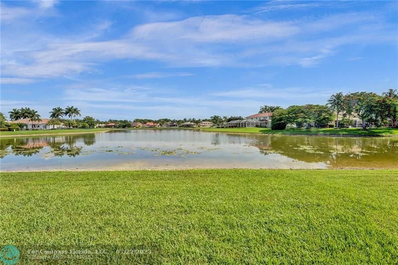 12355 Rockledge Circle Boca Raton, FL 33428 - Photo 32 of 38 a view of a lake with houses in the back