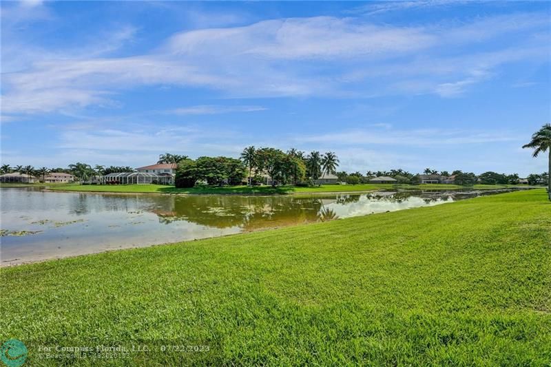 12355 Rockledge Circle Boca Raton, FL 33428 - Photo 33 of 38 a view of a lake with houses in the background