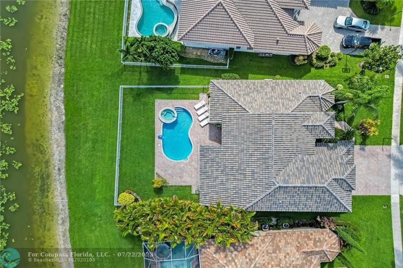 12355 Rockledge Circle Boca Raton, FL 33428 - Photo 34 of 38 a aerial view of a house with a yard and tennis court