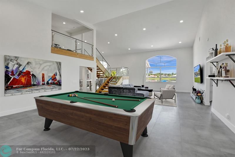 12355 Rockledge Circle Boca Raton, FL 33428 - Photo 4 of 38 a living room with furniture pool table and wall paintings