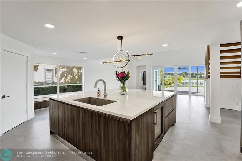 12355 Rockledge Circle Boca Raton, FL 33428 - Photo 9 of 38 a kitchen with a sink and cabinets