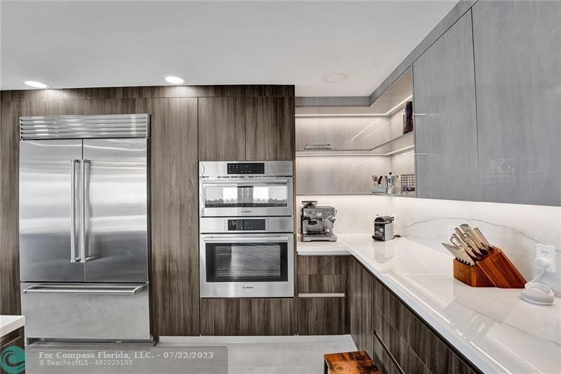 12355 Rockledge Circle Boca Raton, FL 33428 - Photo 10 of 38 a kitchen with a refrigerator and a sink