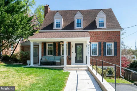 a view of a brick house with a yard