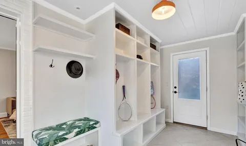 a bathroom with a shower and mirror