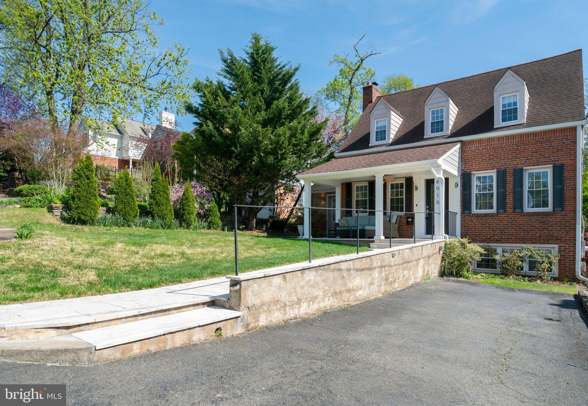4916 26th Street North Arlington, VA 22207 - Photo 2 of 46 front view of a house with a yard
