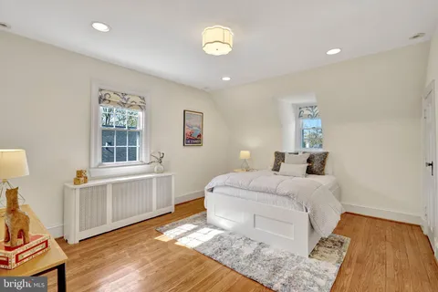a bedroom with a bed and a table