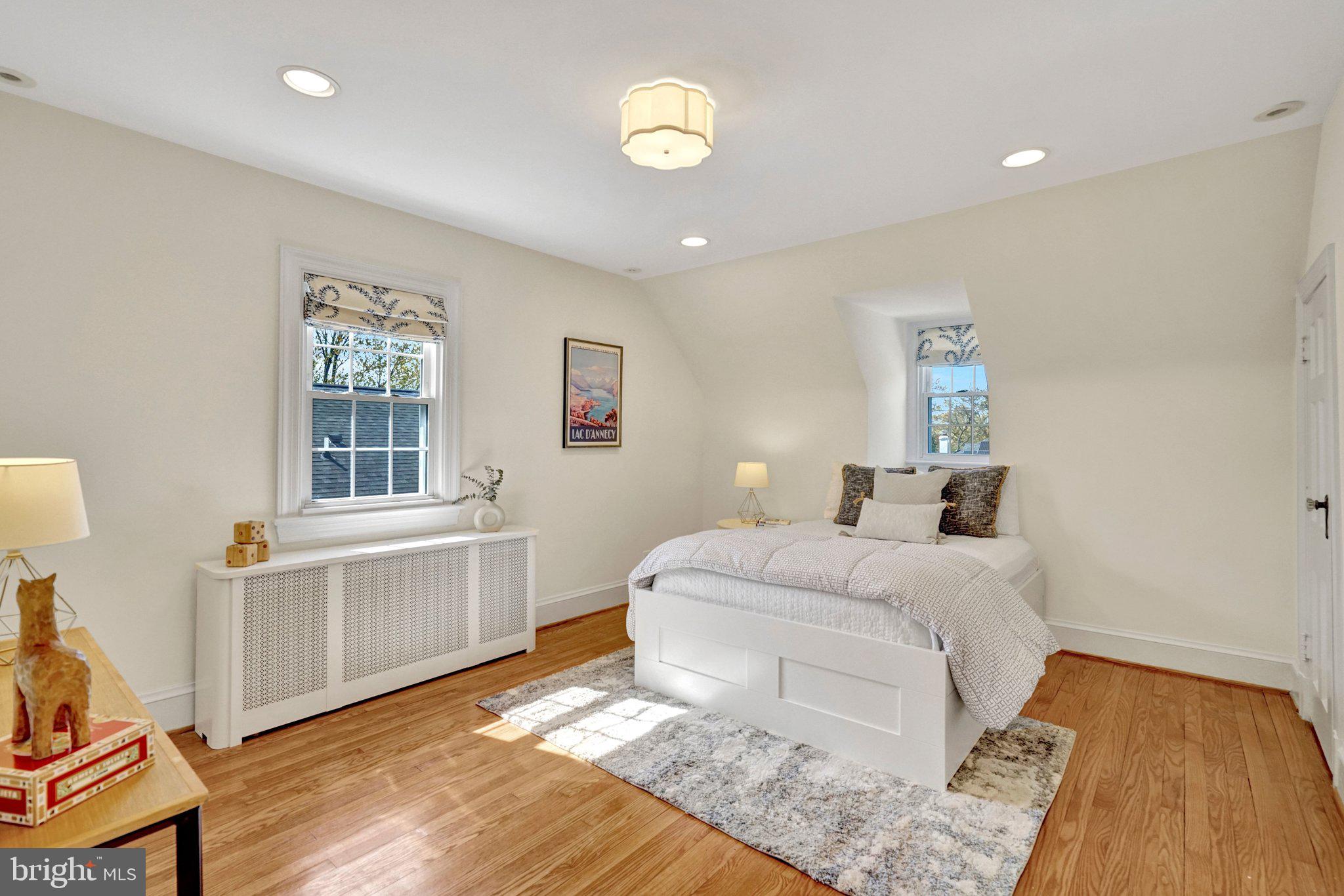 4916 26th Street North Arlington, VA 22207 - Photo 21 of 46 a bedroom with a bed and a table