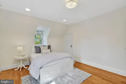 a bedroom with a bed and a table