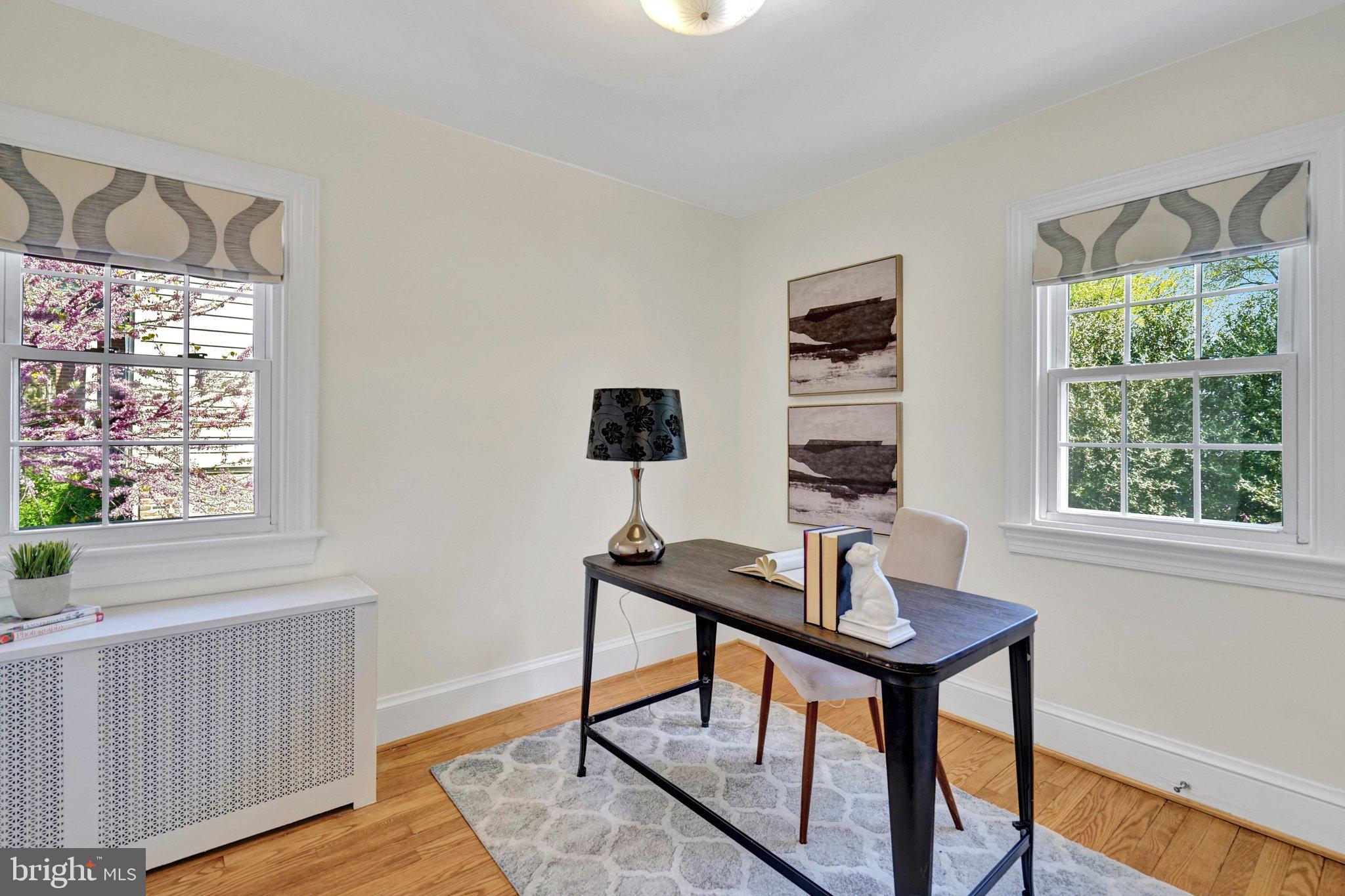 4916 26th Street North Arlington, VA 22207 - Photo 28 of 46 a view of a workspace with furniture and a window