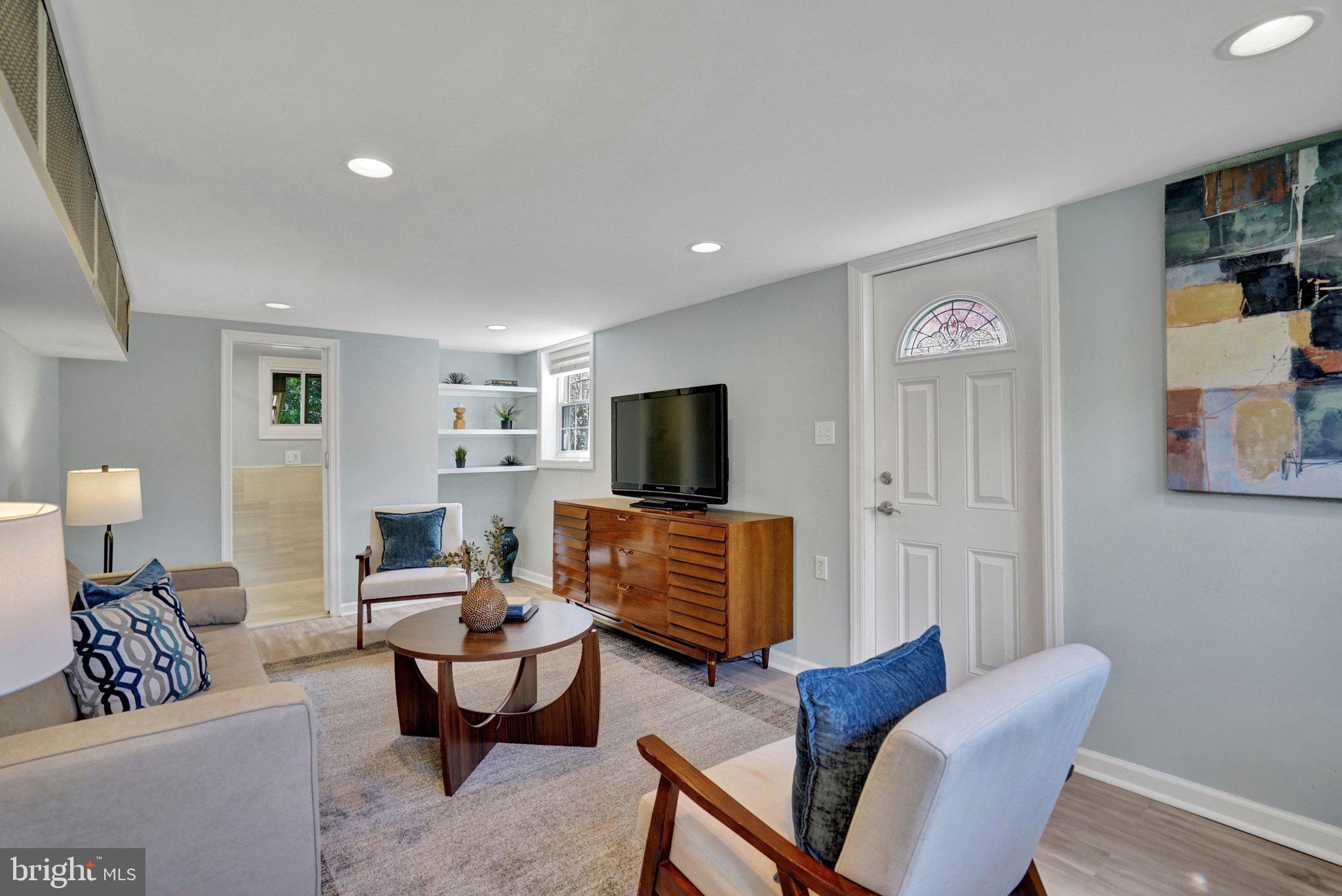 4916 26th Street North Arlington, VA 22207 - Photo 33 of 46 a living room with furniture and a flat screen tv