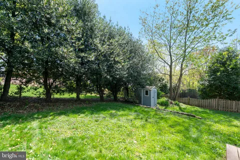 a view of a backyard with a small cabin