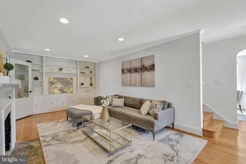 a living room with furniture and a rug