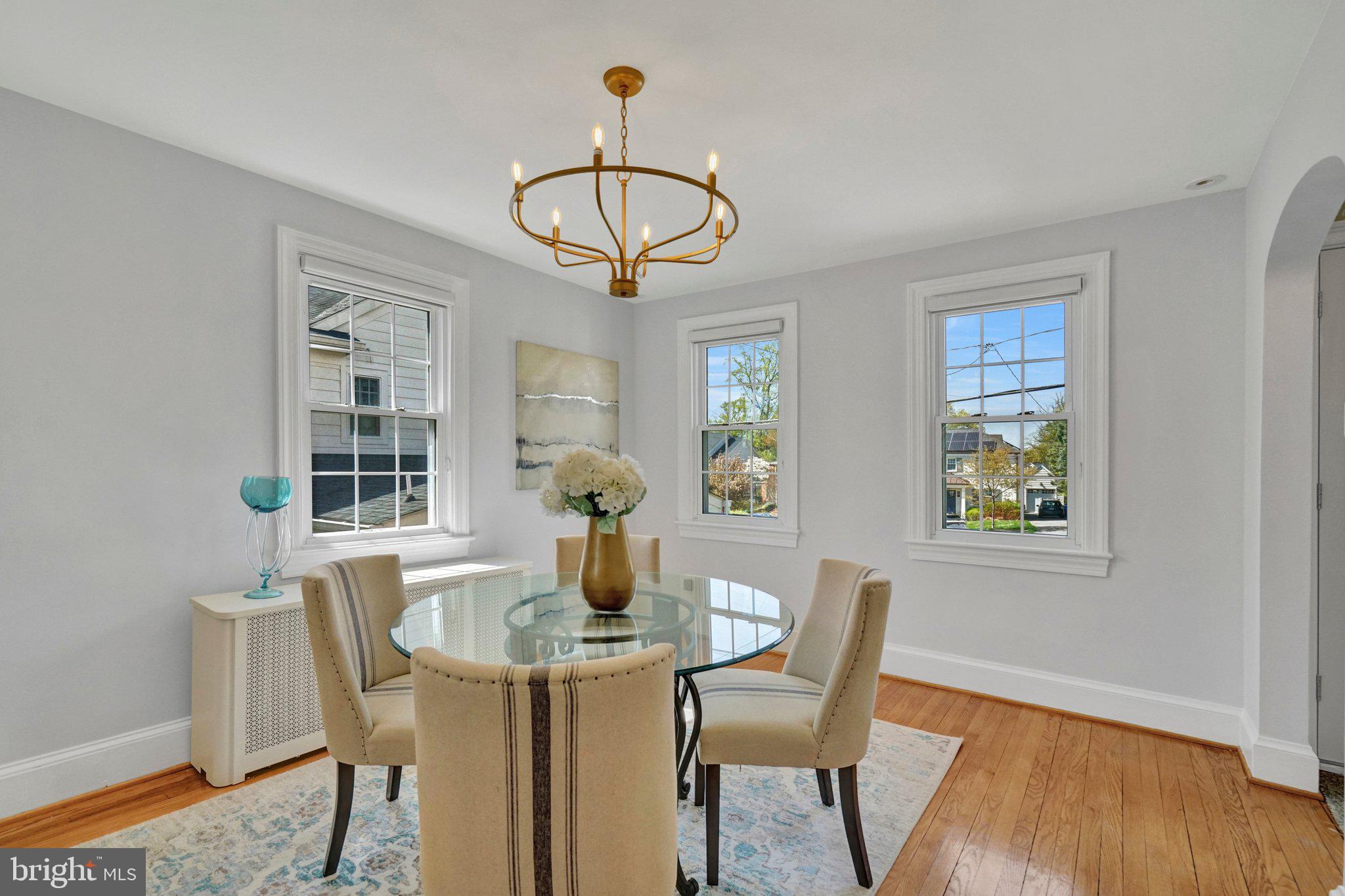 4916 26th Street North Arlington, VA 22207 - Photo 7 of 46 a view of a dining room with furniture window and wooden floor