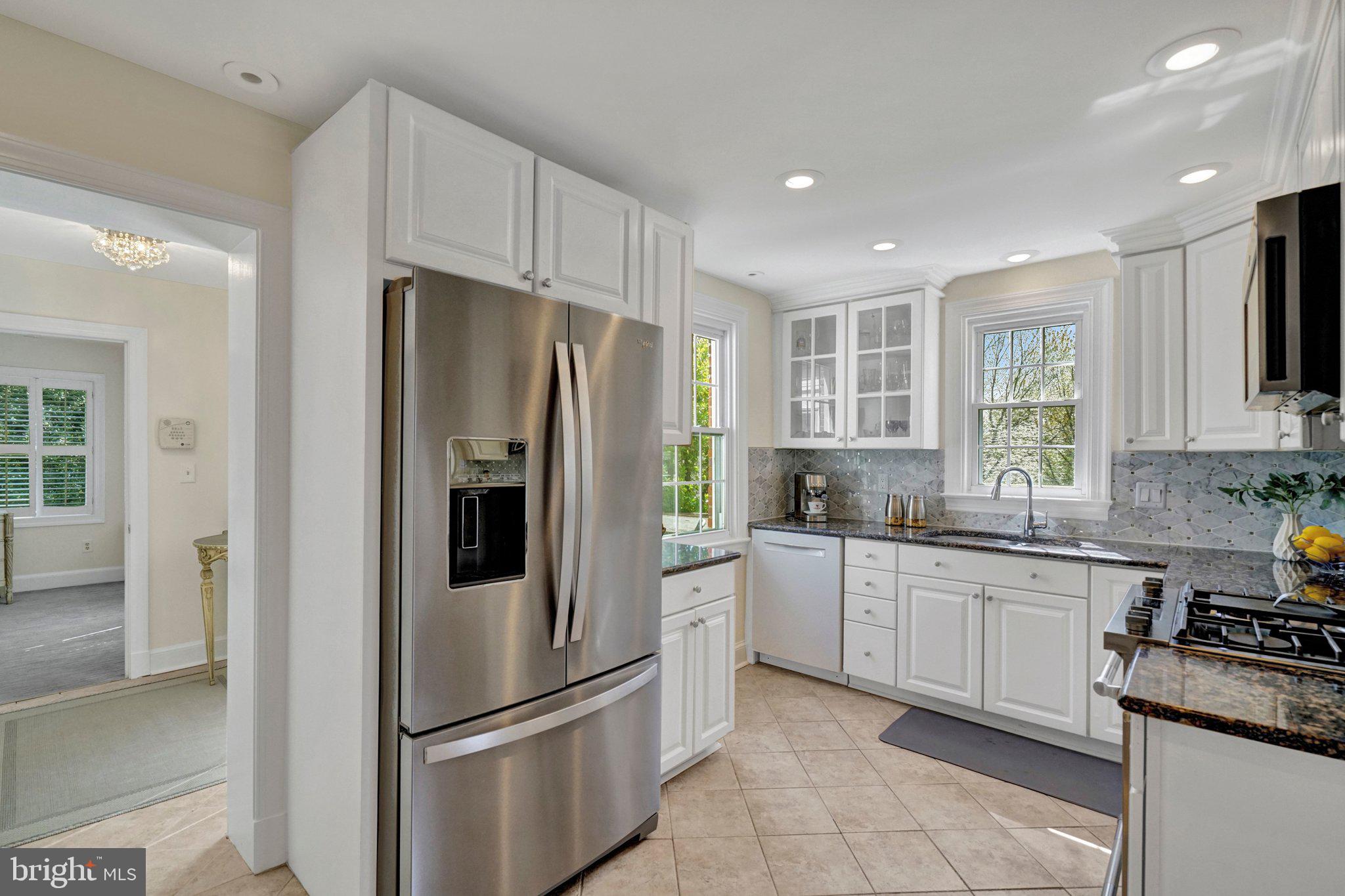 4916 26th Street North Arlington, VA 22207 - Photo 10 of 46 a kitchen with stainless steel appliances granite countertop a refrigerator sink and stove