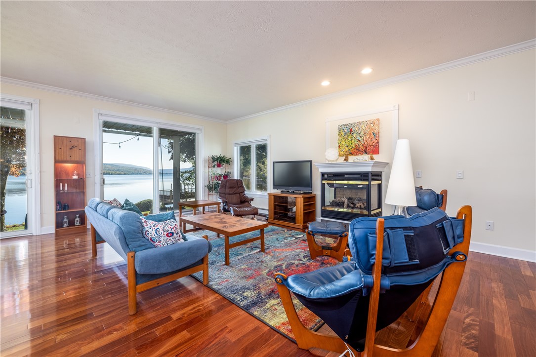 8833 Sandy Bottom Road Richmond, NY 14471 - Photo 20 of 50 SPECTACULAR GREAT ROOM WITH GAS FIREPLACE & WALL O