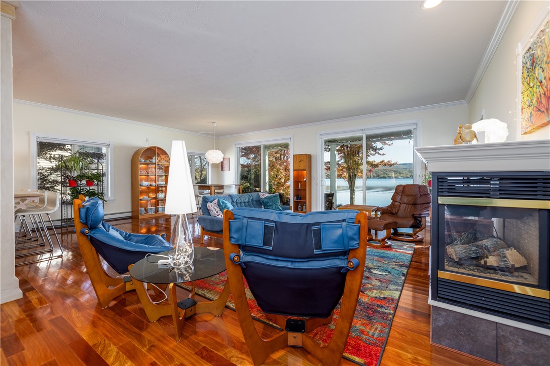 8833 Sandy Bottom Road Richmond, NY 14471 - Photo 21 of 50 SPECTACULAR GREAT ROOM WITH GAS FIREPLACE & WALL O