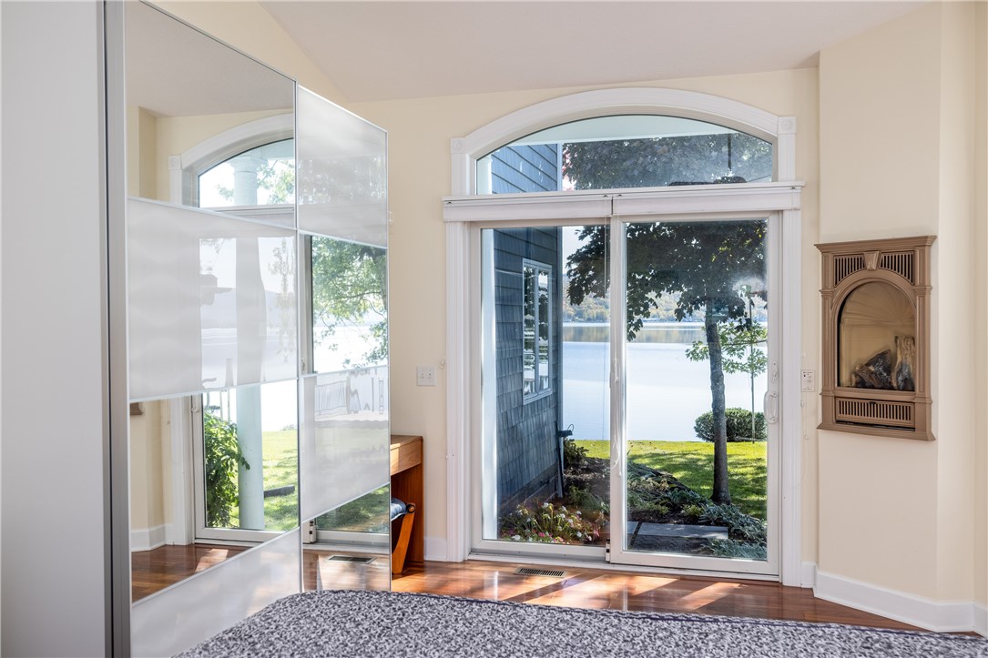 8833 Sandy Bottom Road Richmond, NY 14471 - Photo 26 of 50 1ST FLOOR PRIMARY SUITE WITH LAKE VIEWS & ACCESS T