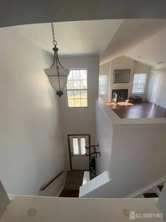 a room with a couch and a chandelier