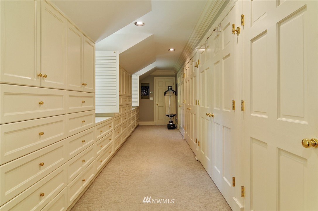 21 Cherry Loop Northwest Shoreline, WA 98177 - Photo 14 of 25 a view of a hallway with wooden floor and cabinet