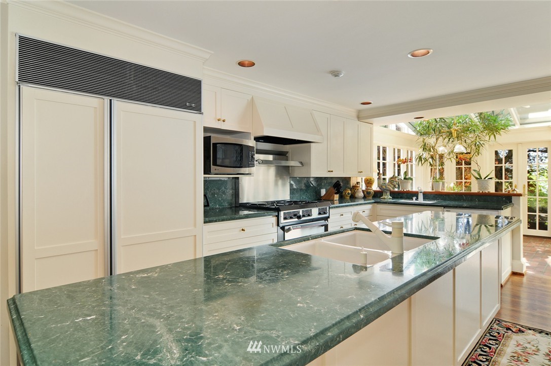 21 Cherry Loop Northwest Shoreline, WA 98177 - Photo 10 of 25 a kitchen with stainless steel appliances granite countertop a sink a stove and a refrigerator