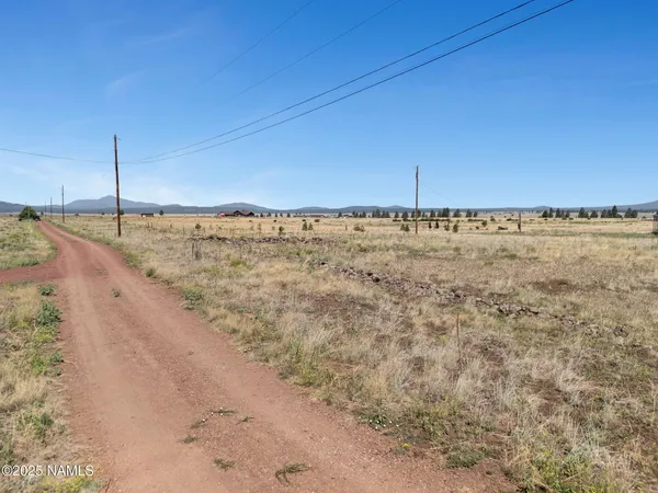 a view of a road with an ocean view