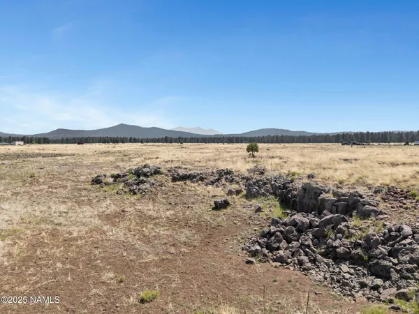 a view of an ocean beach and mountain