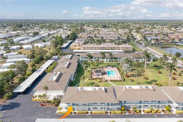 an aerial view of residential houses with outdoor space