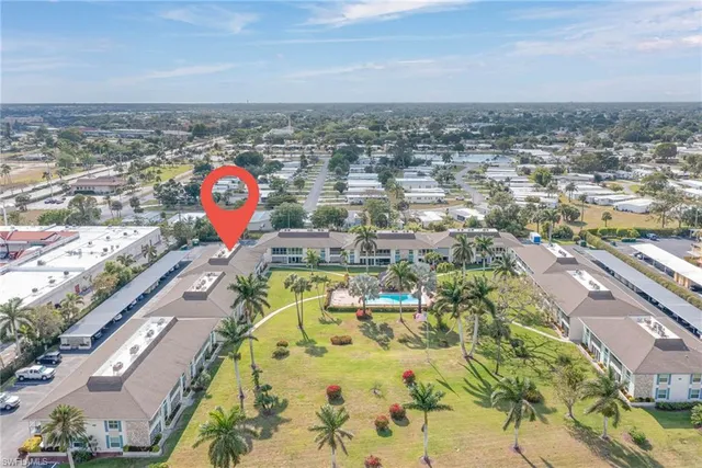 an aerial view of a house with a ocean view
