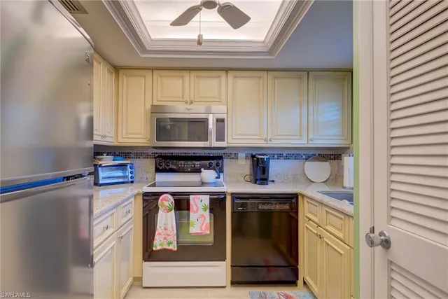 a kitchen with stainless steel appliances granite countertop a stove and a microwave