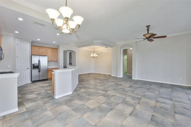 a view of a kitchen with a sink stainless steel appliances and cabinets