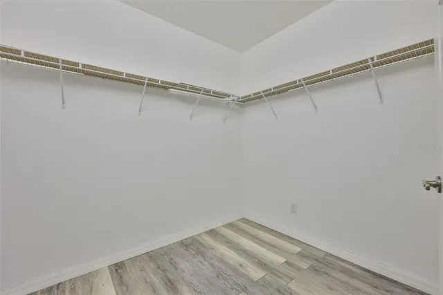 a bathroom with a double vanity sink mirror and a shower