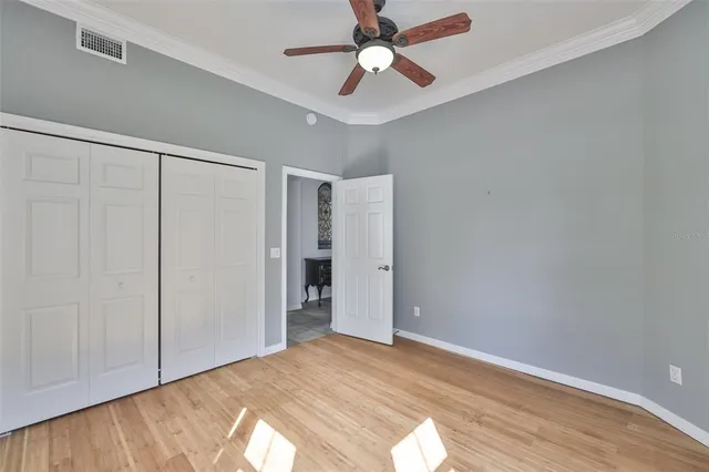 a view of room with window and ceiling fan