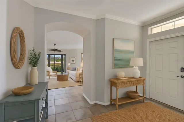 a living room with furniture and a mirror