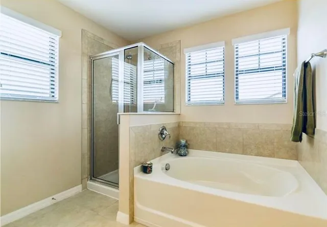 a white bath tub sitting next to a window