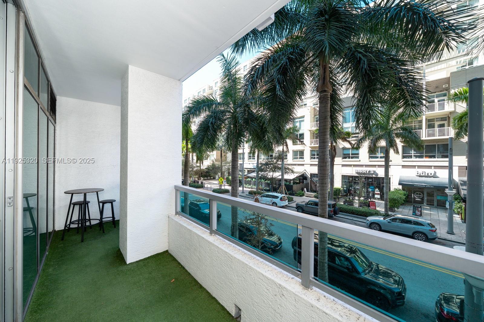 3301 Northeast 1st Avenue, Unit M0201 Miami, FL 33137 - Photo 11 of 20 a view of a swimming pool with a garden and patio