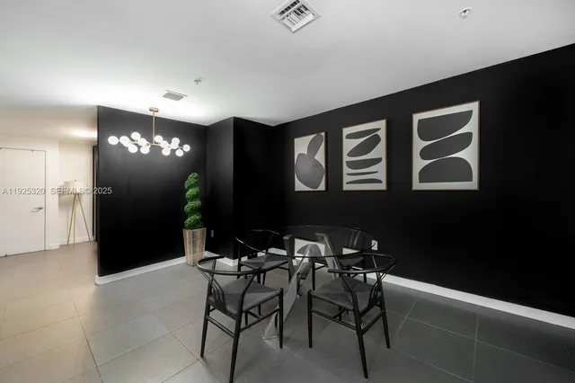 a view of a livingroom with furniture and chandelier