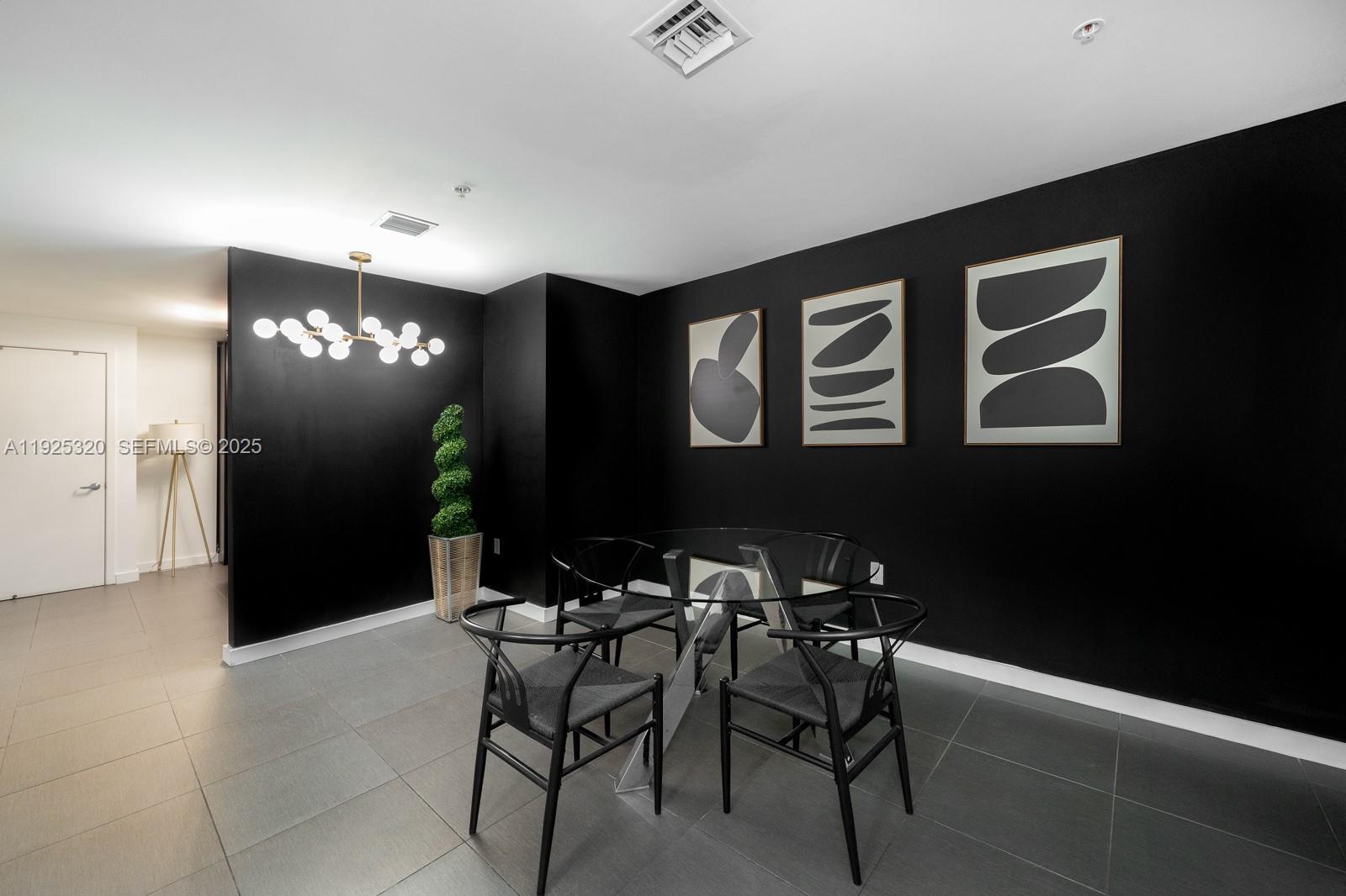 3301 Northeast 1st Avenue, Unit M0201 Miami, FL 33137 - Photo 8 of 20 a view of a livingroom with furniture and chandelier