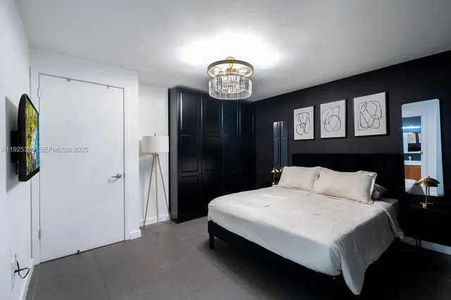 a bedroom with a bed and a closet