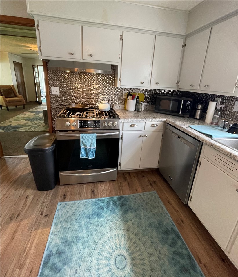 360 Ridge Street Piqua, OH 45356 - Photo 9 of 46 This efficient kitchen offers everyday convenience with modern appliances and durable flooring.